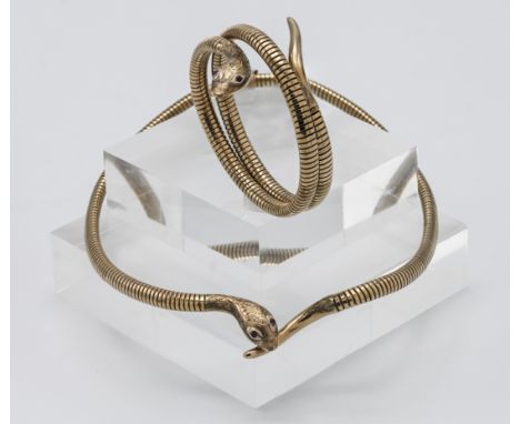 A 9ct gold snake necklace set with ruby eyes together with a matching snake bracelet also set with ruby eyes, total weight ap