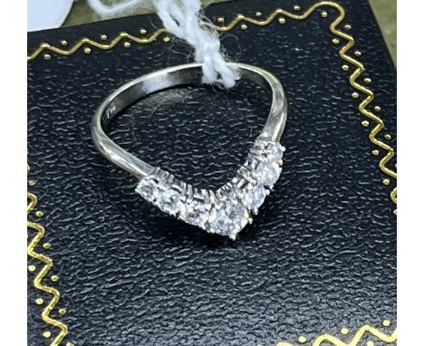 An 18ct white gold and diamond wishbone ring, size M/N.