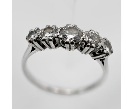 A fine diamond five stone ring, set in white gold or platinum (unmarked), size N.