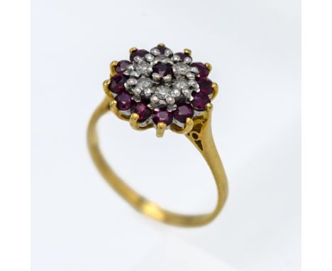 An 18ct ruby and diamond cluster ring, size Q.