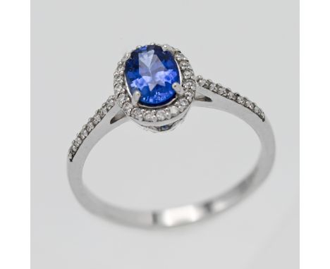 An 18ct white gold diamond and sapphire ring, size N.