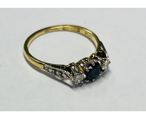 An 18ct yellow gold diamond and sapphire ring, size N/O.