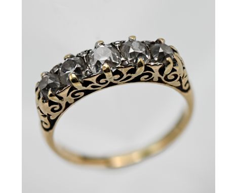 An 18ct five stone diamond ring set with old cut diamonds, size M/N.