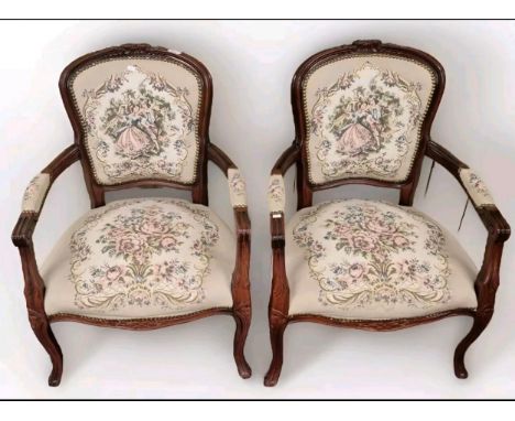 A Pair of reproduction Arms chairs, detailed with needlework tapestry.