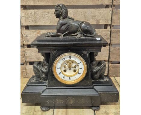 19th century Egyptian Revival slate and bronze mantel clock; Mounted with Bronze sphinx and two crouching bronze Egyptian fig