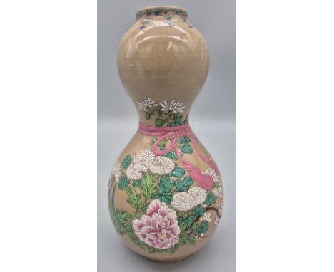 19th century Japanese Meiji period Gourd vase. Enamel painted raised relief flower design and pink cord tied around the vase 