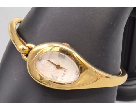 GUCCI 103 Gold Floral Horsebit Bangle Watch, Gold Toned, Stainless Steel case and bracelet. Quartz movement and a sapphire cr