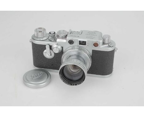 A Leica IIIf Delay Red Dial Rangefinder Camera,1955, chrome, serial no. 794201, with Summitar f/2 50mm lens, 1940, chrome, se