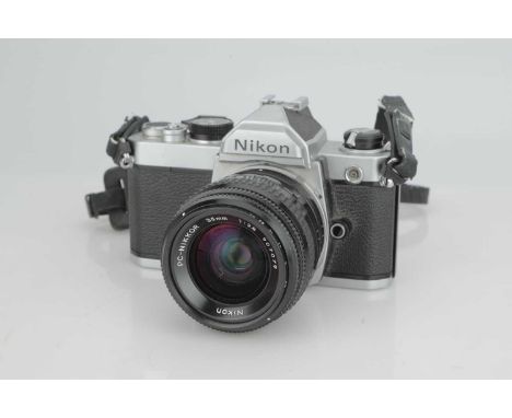 A Nikon FM SLR Camera,with Nikon PC-Nikkor f/2.8 35mm lens, body, G, shutter working, lens, VG, some very light traces of haz