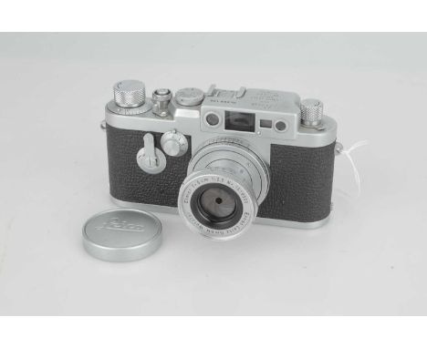 A Leica IIIg Rangefinder Camera,1960, chrome, serial no. 988106, with Leitz Elmar f/2.8 50mm lens, 1958, chrome, serial no. 1