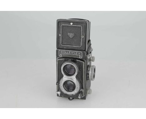 A Rollei Rolleiflex T TLR Camera,with Carl Zeiss Tessar f/3.5 75mm lens, body, F-G, shutter working, lens, F-G, some light in