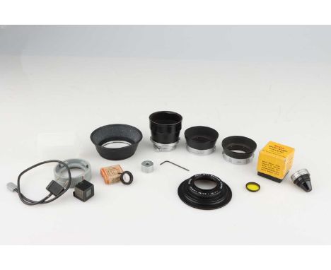 A Selection of Camera Accessories,including a Leitz Elmar 9cm / Hector 13.5cm lens hood, a Kodak Wide-Angle Converter, a Leit