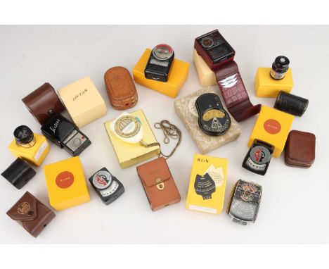 A Selection of Light Meters in Yellow Presentation Boxes,including a Mini Rex III, a RÄ“alt Luxe, a Tempophot Exposure Meter,