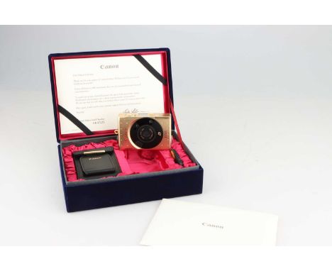 A Canon Ixus IX240 Limited Edition APS Camera,gold, body VG-E, in blue felt-like covered presentation case, containing a leat