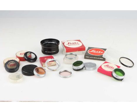 A Selection of Leica Accessories,including a Leica M to Leica Screw 90mm adapter, an E. Leitz N.Y. SL Filter, and much more. 