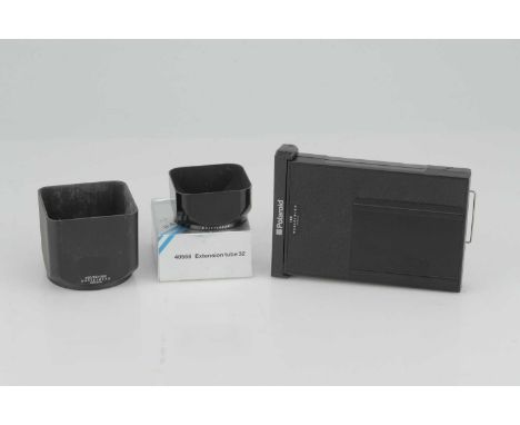 A Small Selection of Hasselblad Accessories,including Extension TUbe 32, Polaroid 100 back and two lens hoods (4)