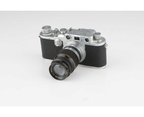 A Leica IIIc Rangefinder Camera,chrome, serial no. 373306, with Leitz Elmar f/4 90mm lens, black, serial no. 518223, body, F-