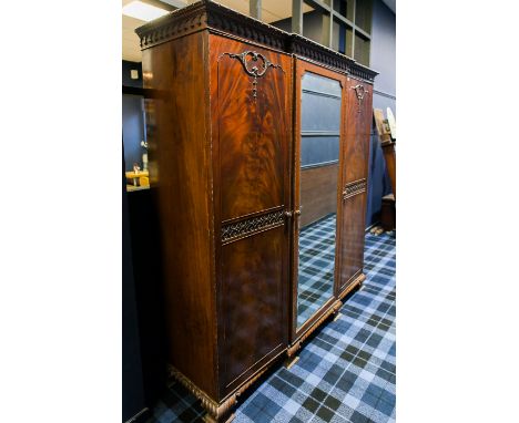 MAHOGANY TRIPLE BREAKFRONT WARDROBE OF GEORGE III DESIGN 
the moulded cornice with two hanging compartments and a fitted sect