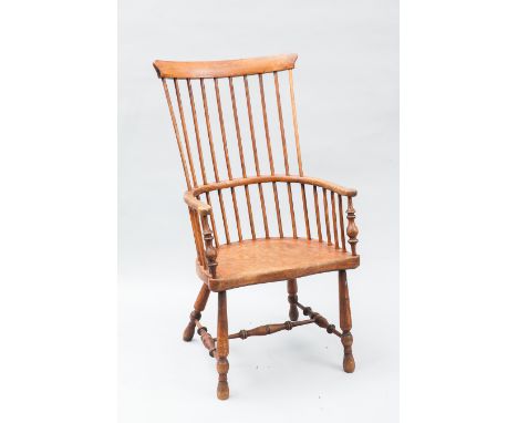 EARLY 20TH CENTURY WINDSOR CHAIR
with panel and raised comb-back, the saddle shaped seat on tuned legs having H-shaped stretc