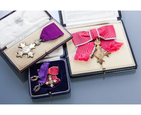 TWO OFFICER OF THE ORDER OF THE BRITISH EMPIRE NECK BADGES
gentlemen's award with purple grosgrain ribbon circa 1917-35, unna