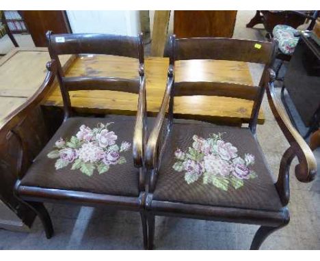 A pair of antique mahogany tapestry seated armchairs