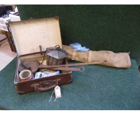 A Safari folding camp bed together with a small leather case containing brass lantern, Bero cook books, miniature oriental va