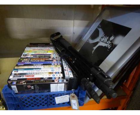 A box of assorted dvds, camera tripod, framed Elvis picture and three framed monochrome photographs of Newcastle