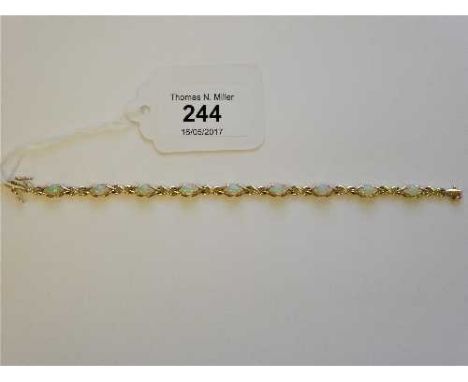 A 14ct gold and opal set bracelet, length 19cm