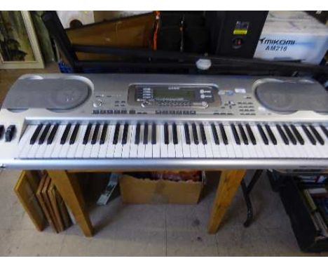 A Casio WK-3500 Smart Media electric keyboard on stand with lead 
