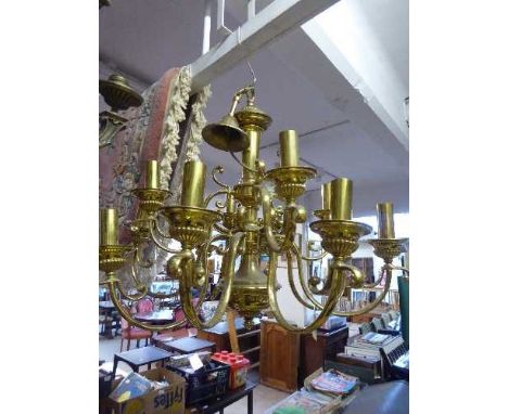 A decorative brass twelve branch chandelier together with two boxes of matching wall lights