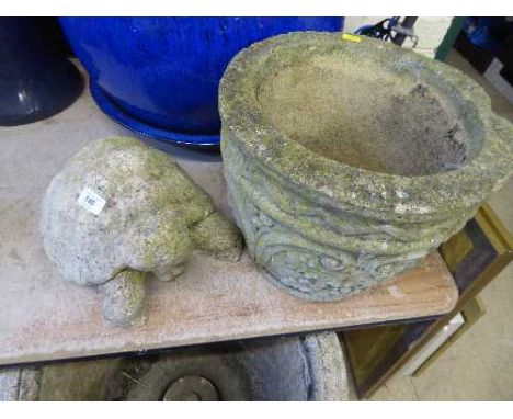 A garden planter and a garden figure of a tortoise 