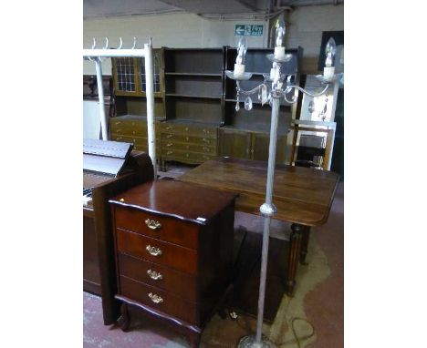 A silvered four-way floor lamp together with a mahogany effect filing chest 