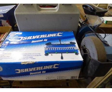 A SilverLine dovetail jig together with a Clarke bench grinder and a cased Nutool electric hammer drill