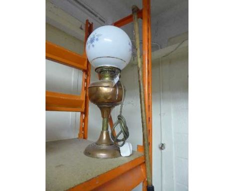 A converted brass oil lamp with shade and chimney, together with a carved horses head walking stick