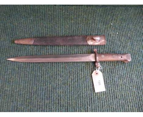 An early 20th century bayonet in leather scabbard 