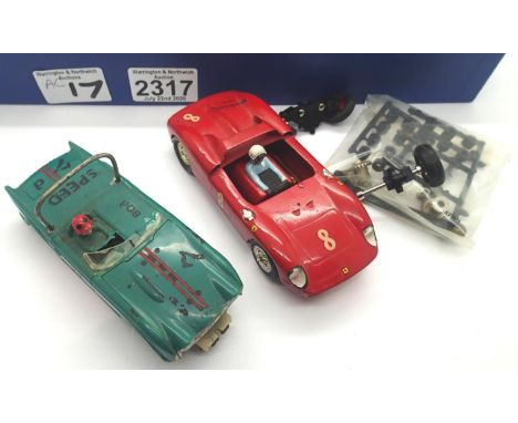 Two vintage slot cars, one Revell TR4, one brass chassis, fixed wheels. P&amp;P Group 1 (£14+VAT for the first lot and £1+VAT