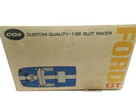 Vintage slot car Cox kit, Ford GT with cast magnesium chassis, built and in original box. P&amp;P Group 1 (£14+VAT for the fi