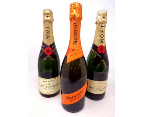 Two bottles of Moet and Chandon champagne together with a further bottle of Mionetto prosecco