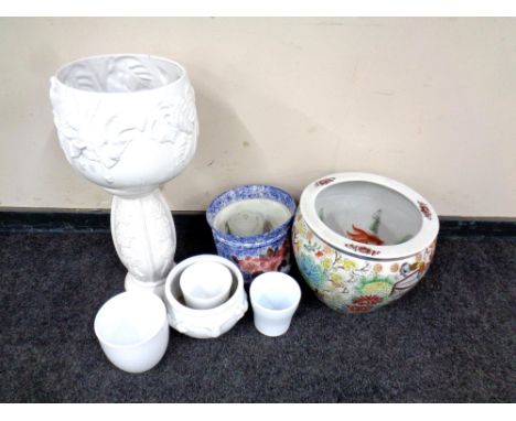 A Chinese style fish bowl planter (a/f) together with further plant pots and a jardiniere stand.