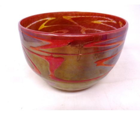 A circular art glass bowl red and iridescent (diameter 20 cm) indistinctively signed to base 