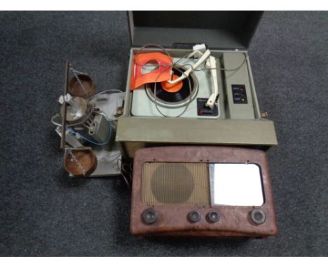 A mid 20th century Defiant table top record player together with a vintage valve radio and a set of balance scales mounted on