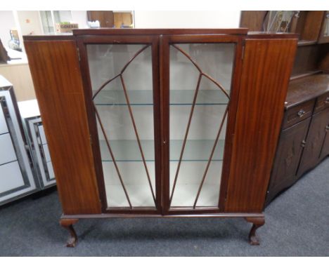 A mahogany Art Deco display cabinet on claw and ball feet
