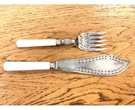 A fish knife and fork with Silver ferrules.