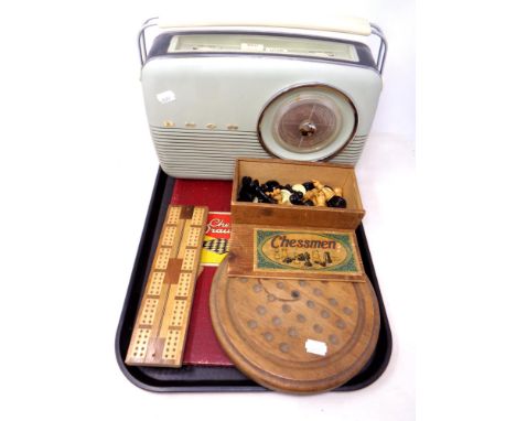 A vintage Bush radio together with a boxed set of French Chessmen pieces, draughts pieces, wooden solitaire and cribbage boar