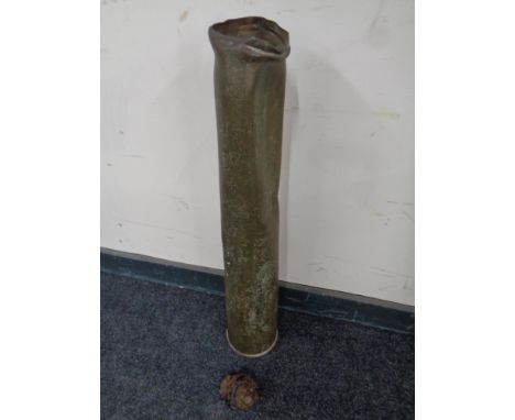 A large brass ammunition shell together with a part-exploded shell