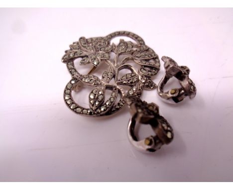 A silver Marcasite brooch together with a pair of earrings.