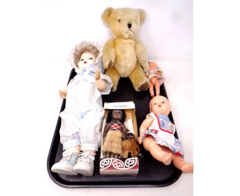 A tray containing a Dean's Toys mohair teddy bear together with four 20th century dolls 