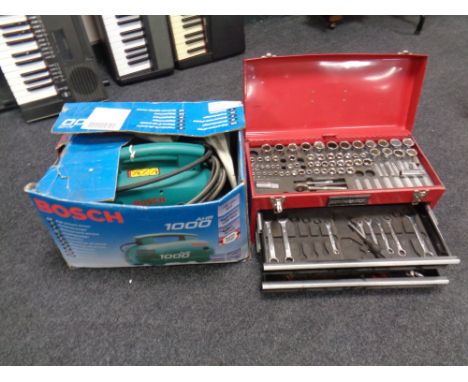 A Dynamic mechanic's tools box containing hand tools, a Bosch 1000 AHR pressure cleaner 