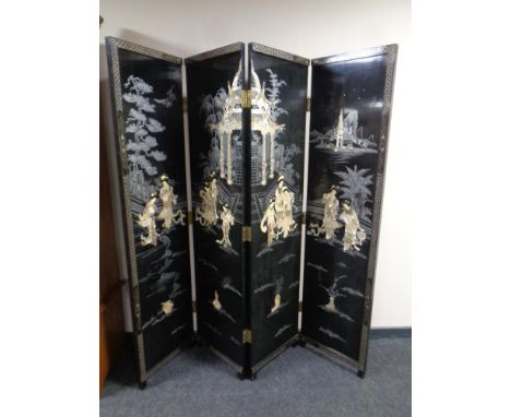 A Japanese lacquered and mother of pearl inlaid four-fold screen  