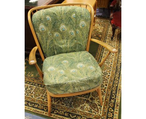 A pair of Ercol Windsor armchairs, designed circa 1955, light beech with spindle backs (2)
